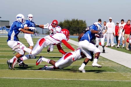 City College defensive back Kenronte Walker tackles Eric Roberson (6) at the College of San Mateo on Oct. 31. RAMSEY EL-QARE / THE GUARDSMAN