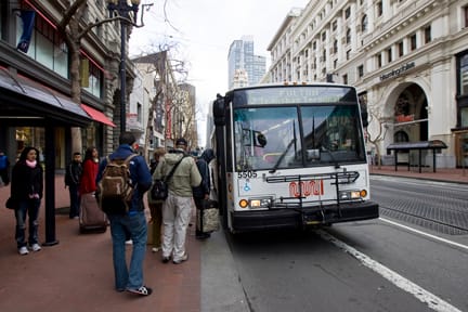_N6X4383_muni_web Passengers board Muni's 5 line at Market and Powell streets on Feb. 8. Muni riders face increased fares and fewer buses. JOSEPH PHILLIPS / THE GUARDSMAN