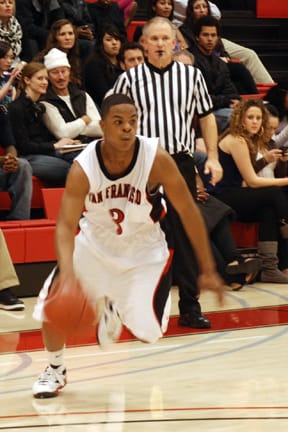 Freshman guard Daryl Cooper brings the ball down the court during a game against Chabot College at the Wellness Center on March 6.
