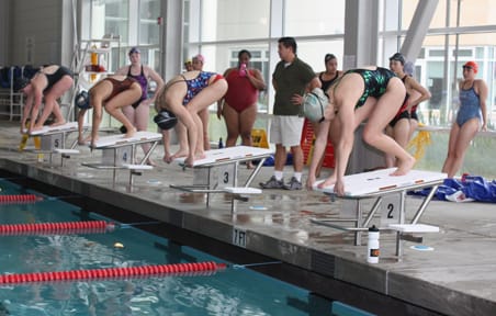 Swiming preview_IMG_0929 City College swimmers prepare to dive off their starting blocks and swim laps during a practice Feb. 18 at the natatorium inside the Wellness Center. AARON TURNER / THE GUARDSMAN