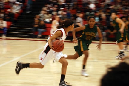 Women's Basketball_DSC_1205_online Freshman guard TC Smith leads a Rams fast break against Ohlone's Jasmine Rubin at the Wellness Center on March 6. RAMSEY EL-QARE / THE GUARDSMAN