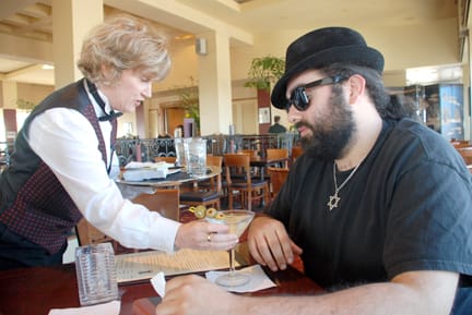 Greg Zeman receives a $13 Martini at the Top of the Mark restaurant in San Francisco on April 6. RAMSEY EL-QARE / THE GUARDSMAN 