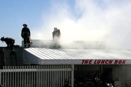 San Francisco firefighters douse a small blaze at the Ocean campus Lunch Box on May 6. ALEX EMSLIE / THE GUARDSMAN