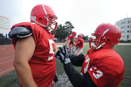 Rams players, guard Jerred Newbery (L) and Leo Rubi (R) face up at City College of San Francisco practice on Sept. 4th.