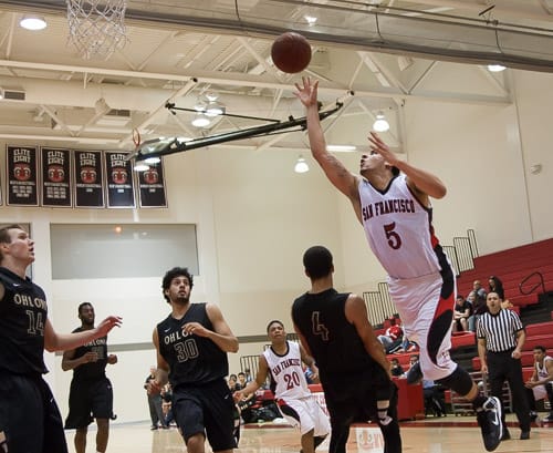San Francisco Rams sophomore guard Kori Babineaux (5) shoots for two points and gets fouled by the Ohlone College Renegades in a CCCAA men’s basketball game on Ocean campus, Friday, Feb. 22, 2014. The Rams won the game 71-63, finishing the regular season 12-0 undefeated. They won the Coast-North Conference title and will compete in playoffs next week. Photo by Santiago Mejia/The Guardsman