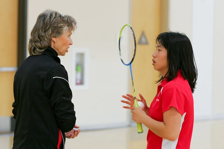 Rams head coach Coni Staff checks-in on sophomore Koni Chen (rank 2) during Chen’s singles match against Skyline’s MJ Phan (rank 1) at Ocean campus, Tuesday, March 25, 2014. Photo by Jackson Ly/The Guardsman