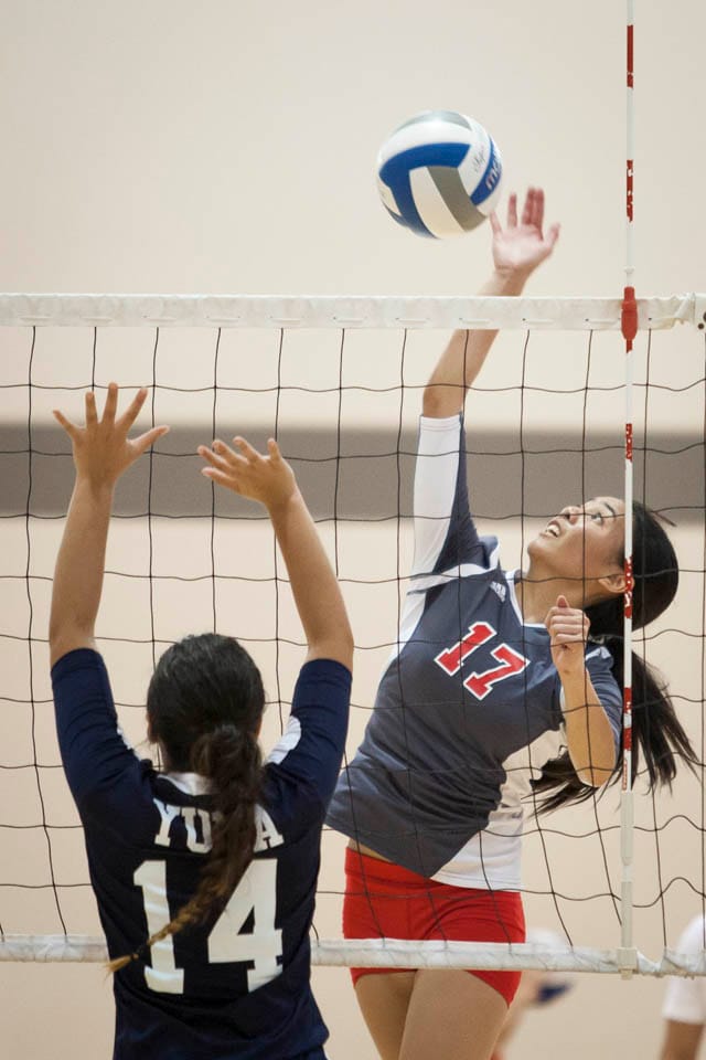 Rams Brianna Caba (16) spikes the ball against Yuba College. (Photo by Santiago Mejia)