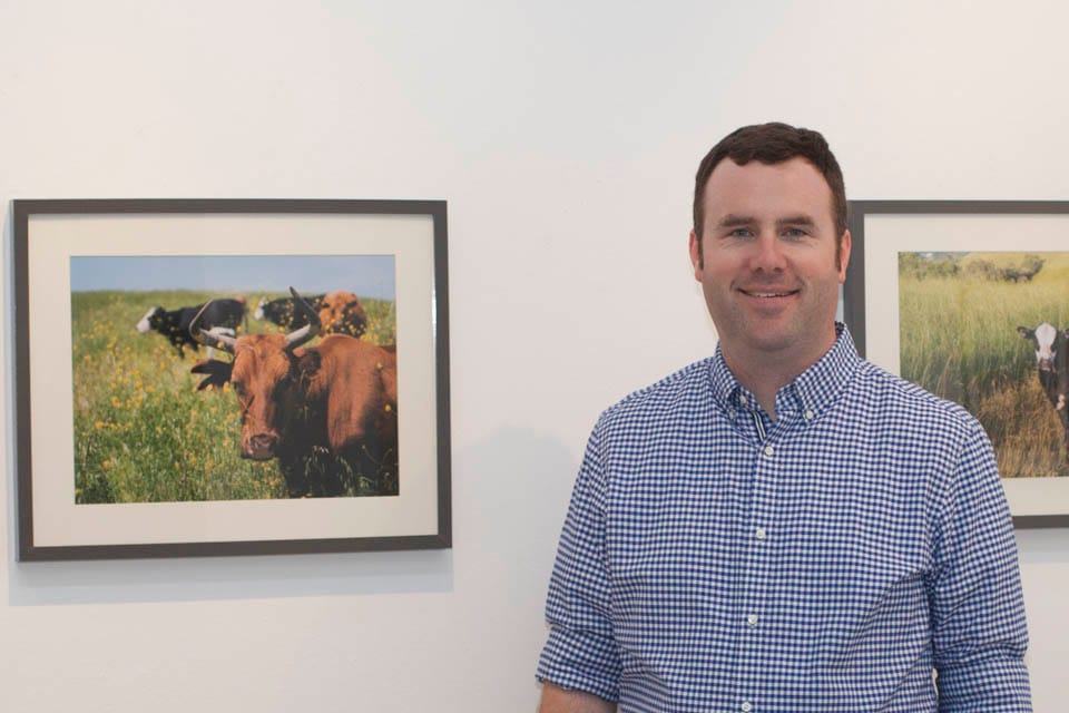 Brian Churchwell celebrates the opening reception of the Orinda Cattle exhibit on Oct. 8 at City College’s Gallery Obscura. (Courtesy photo by Steven Churchwell)