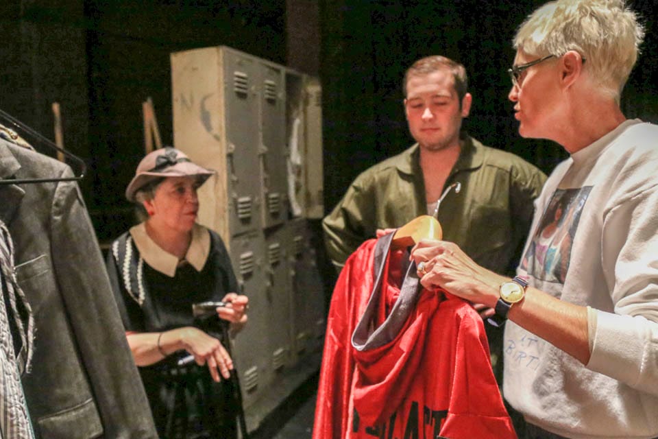 Susan Jackson coordinates actors backstage in Diego Rivera Theatre on Nov. 5. (Photo by Natasha Dangond)