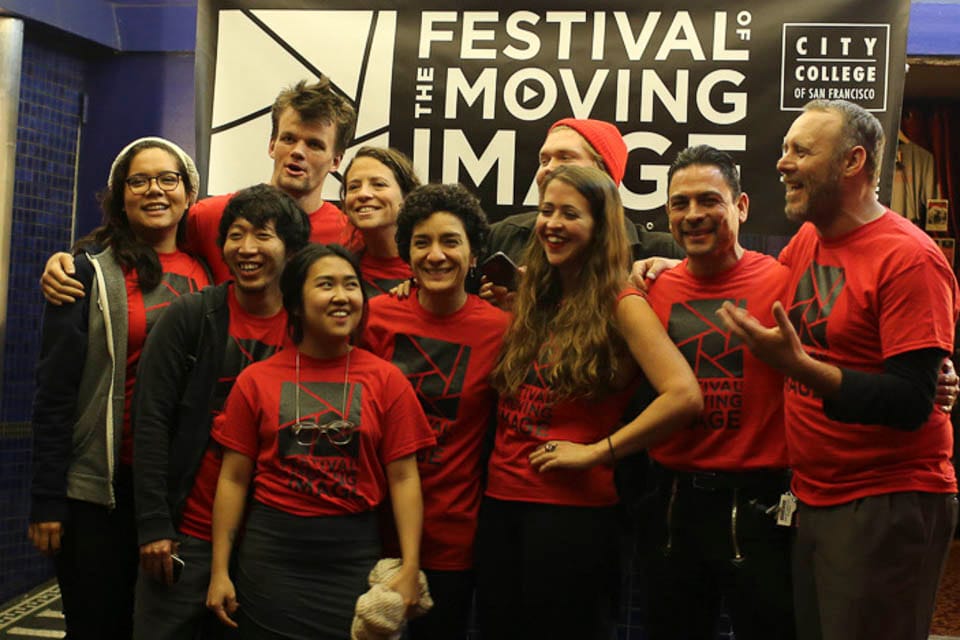 Festival of the Moving Image crew members gather in front of the theater. (Photo by Natasha Dangond)