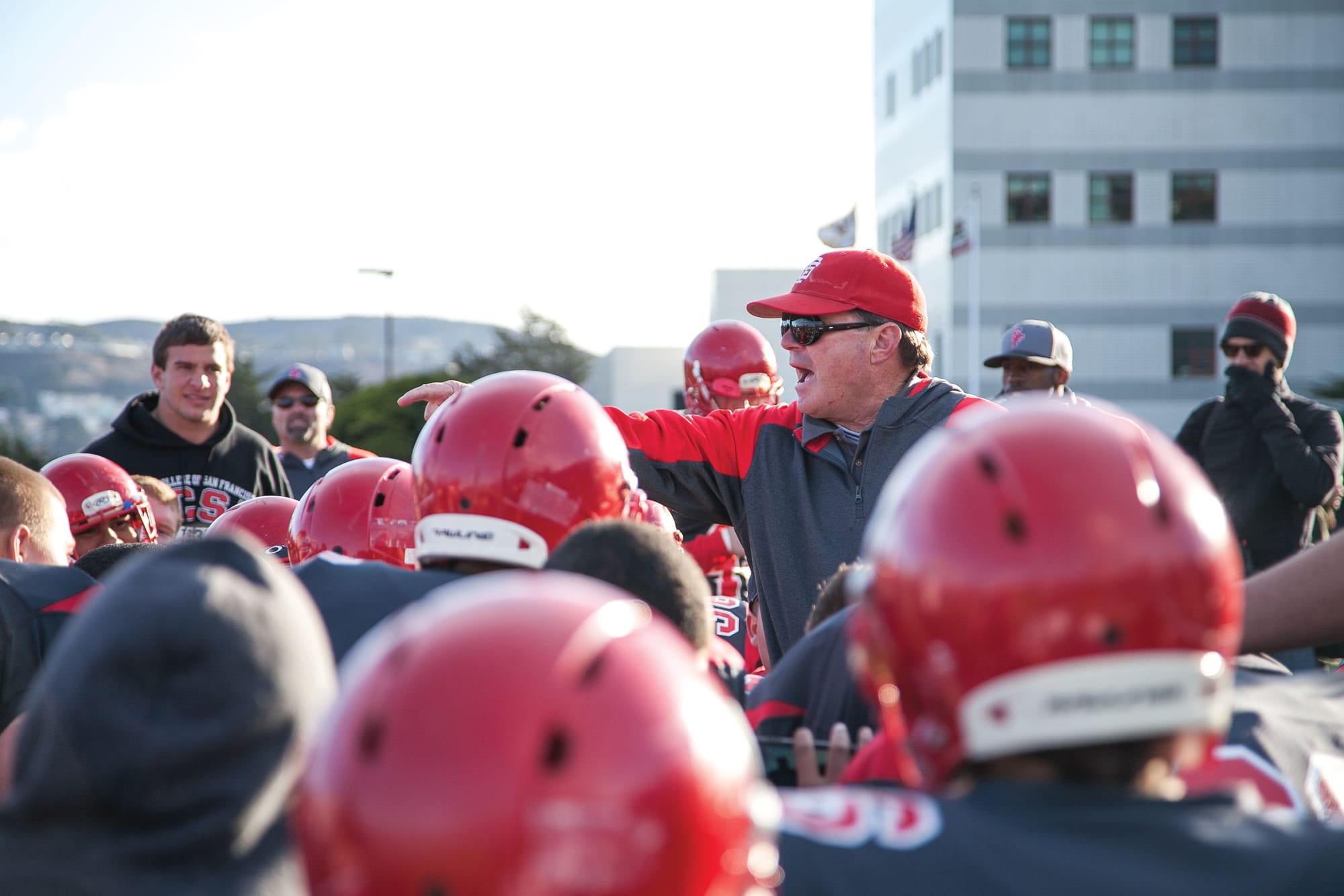 Former Ram’s football Coach George Rush speaks to the team after the San Francisco Community College Bowl in December 2013. The Rams won against the Sierra College Wolverines 59-31. (Photos by Santiago Mejia/The Guardsman)