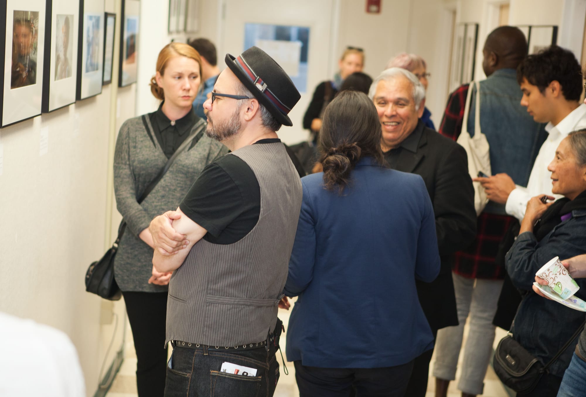 Approximately 100 guests attended the opening reception for “Faces of Hope” at Front Page Gallery in Bungalow 615 on the Ocean Campus. Thursday, Sept. 17, 2015. (Photo by Ekevara Kitpowsong/The Guardsman)