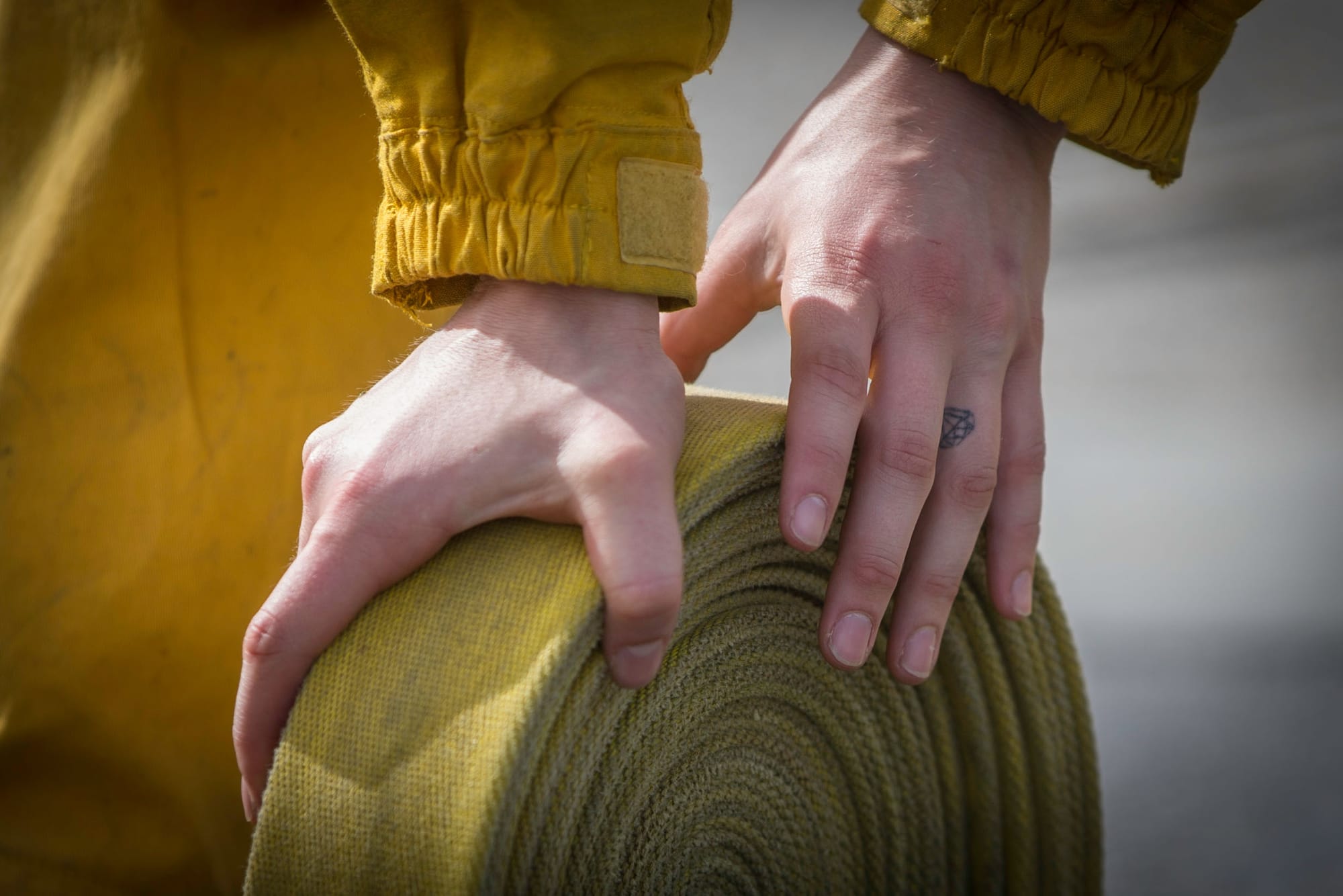 A fire cadet from City College’s Fire Fighter One Academy’s Class 15 practices hose rolls after a long day of wildland training at San Bruno Mountain State Park on Saturday, March 21, 2015. (Photo by Nathaniel Y. Downes/The Guardsman)