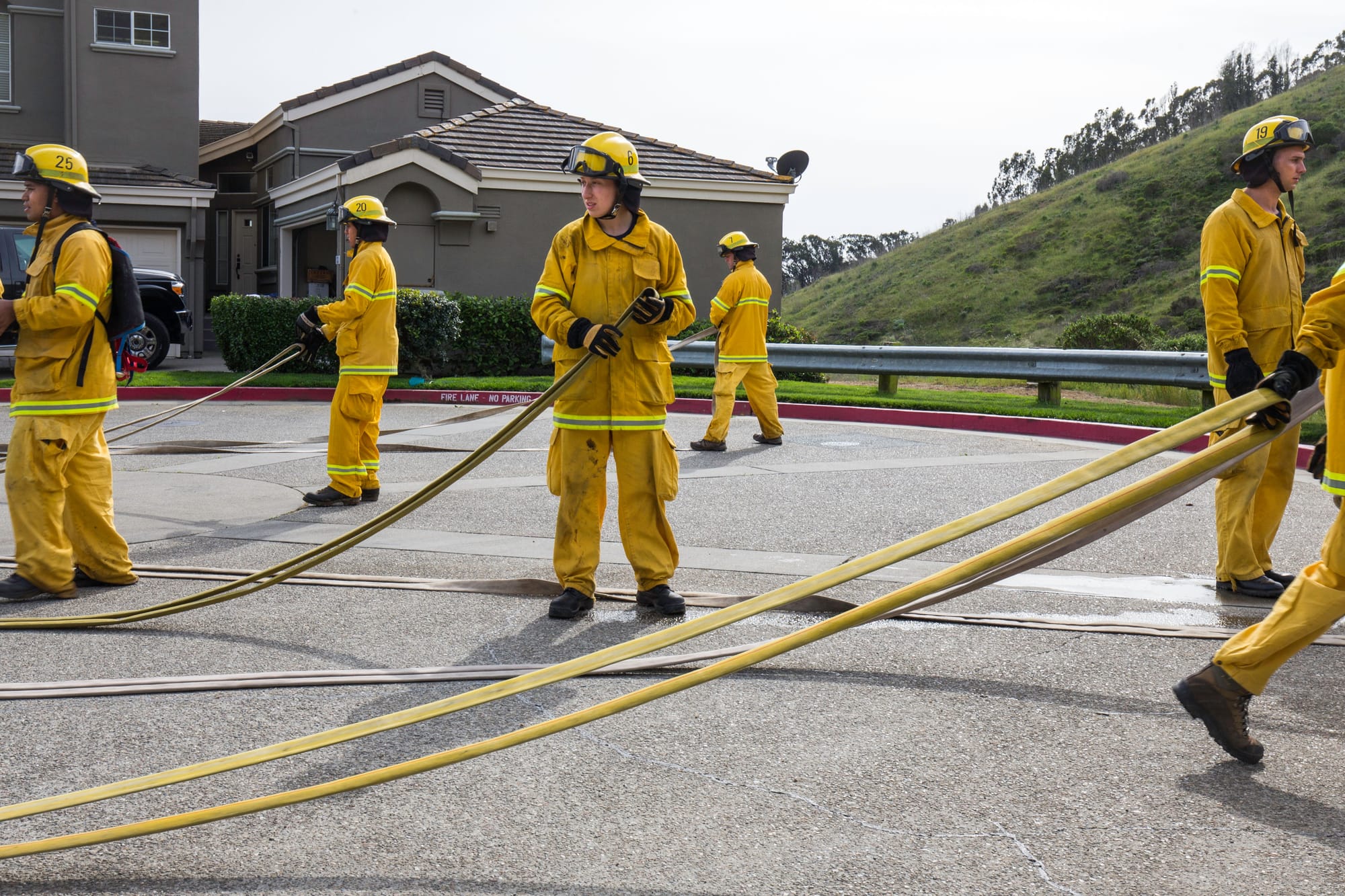 Fire cadets from City College’s Fire Fighter One Academy’s Class 15 prepare hoses for storage and transport after a long day of wildland training at San Bruno Mountain State Park on Saturday, March 21, 2015. (Photo by Nathaniel Y. Downes/The Guardsman)