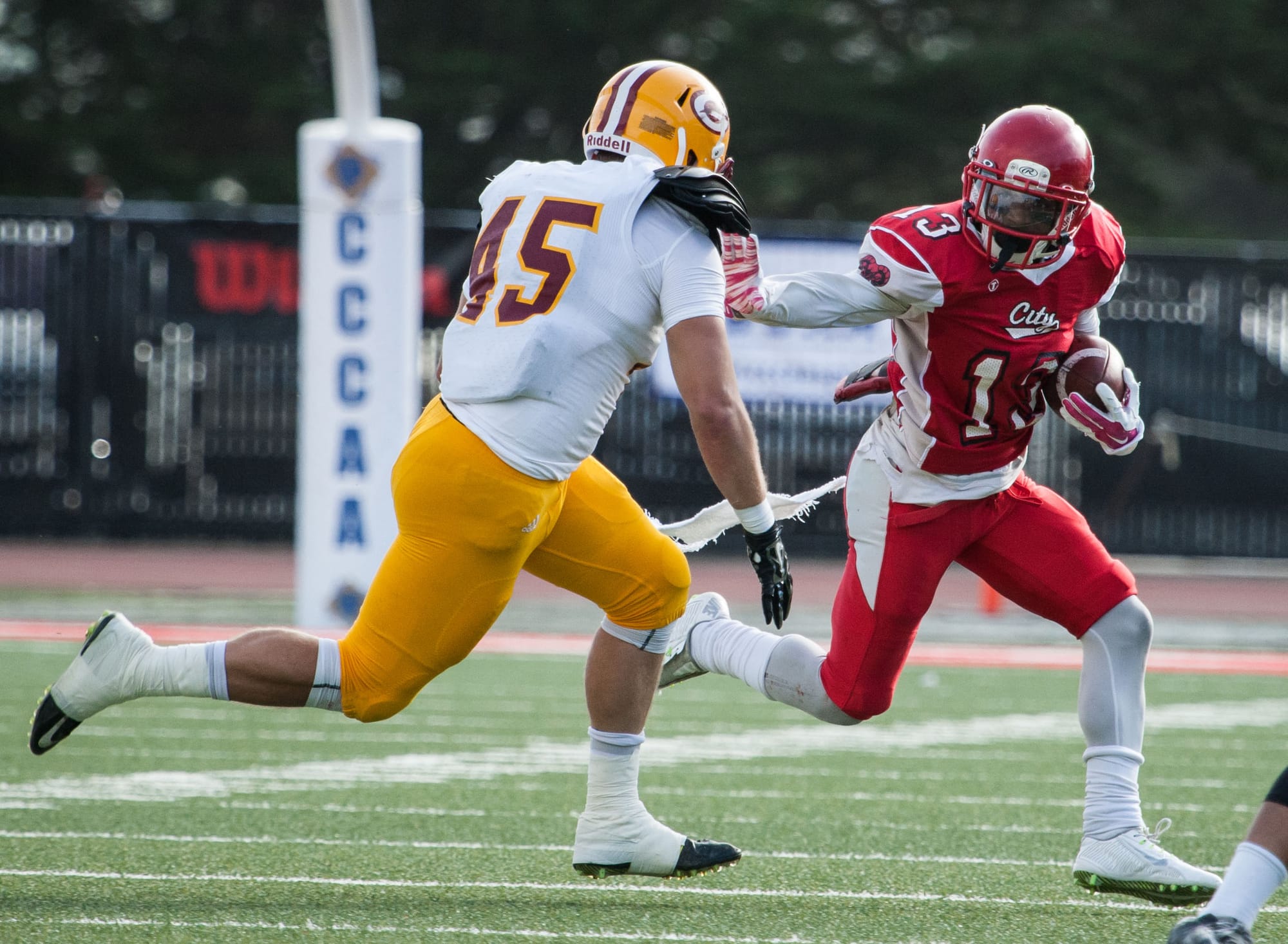 City College’s Namane Modise (RB) (13) breaks through Saddleback College defense during the California Community College state championship game between the City College of San Francisco Rams and the Saddleback College Gauchos at Rush Stadium on Saturday, Dec. 12, 2015 in San Francisco. (Photo by Khaled Sayed/The Guardsman)