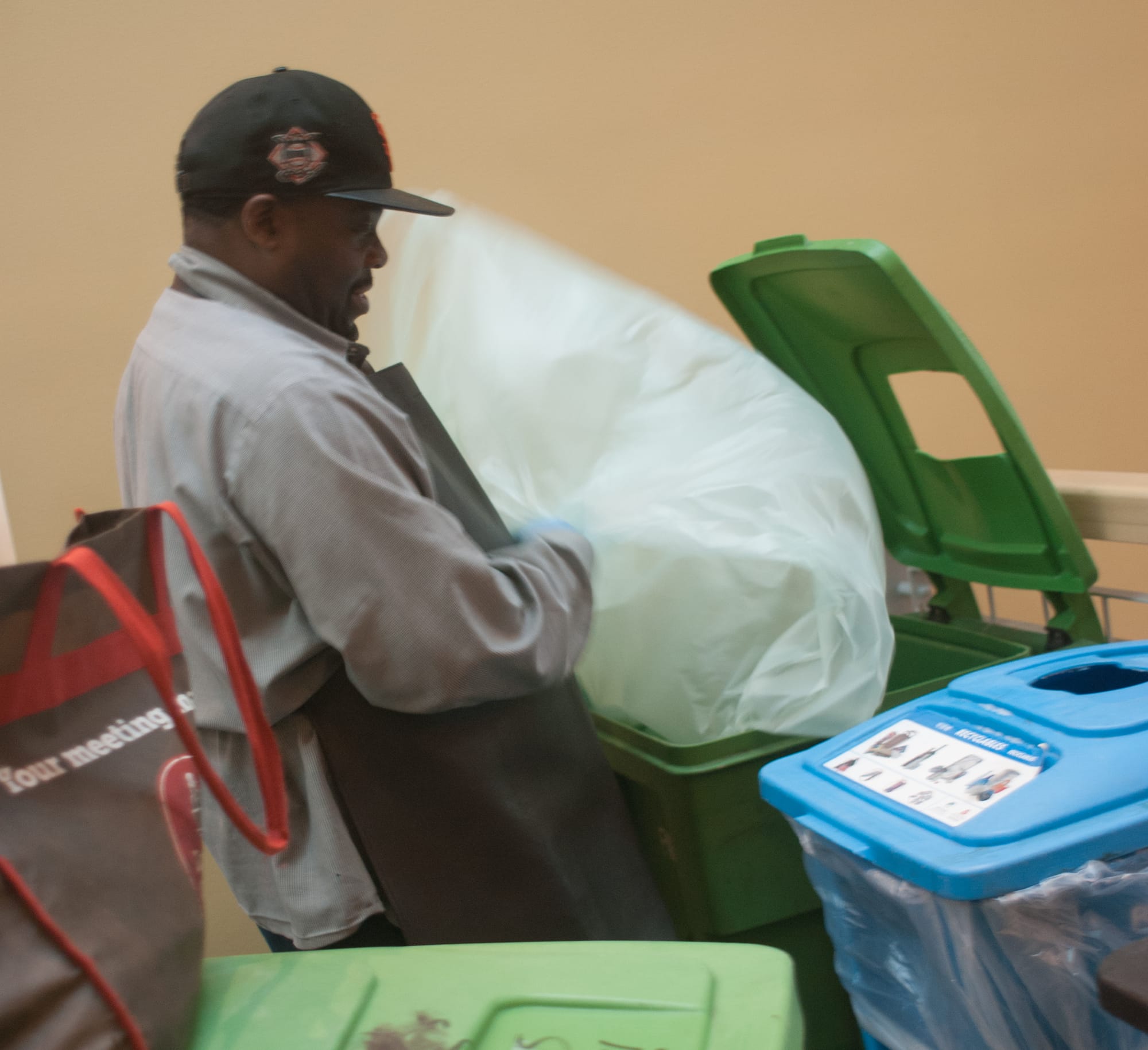 Tim Harper, lead supervisor from the CCSF Recycling Center, picks up the recycling at the MUB building at the Ocean Campus. (Photo by Franchon Smith/ The Guardsman)