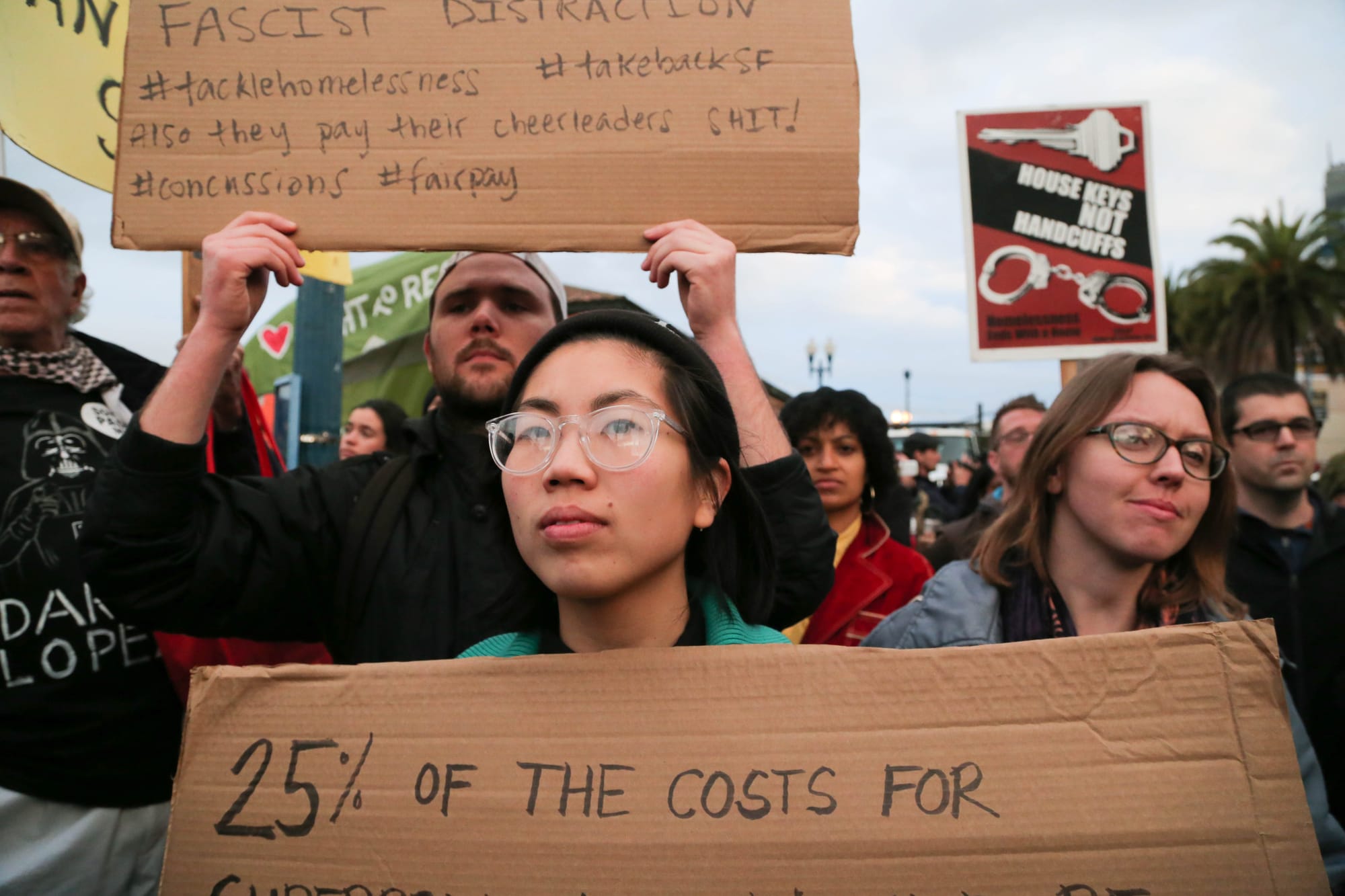 Jaime Vloria listens to a speaker during a rally outside the Ferry Building. (Photo by Gabriella Angotti-Jones)