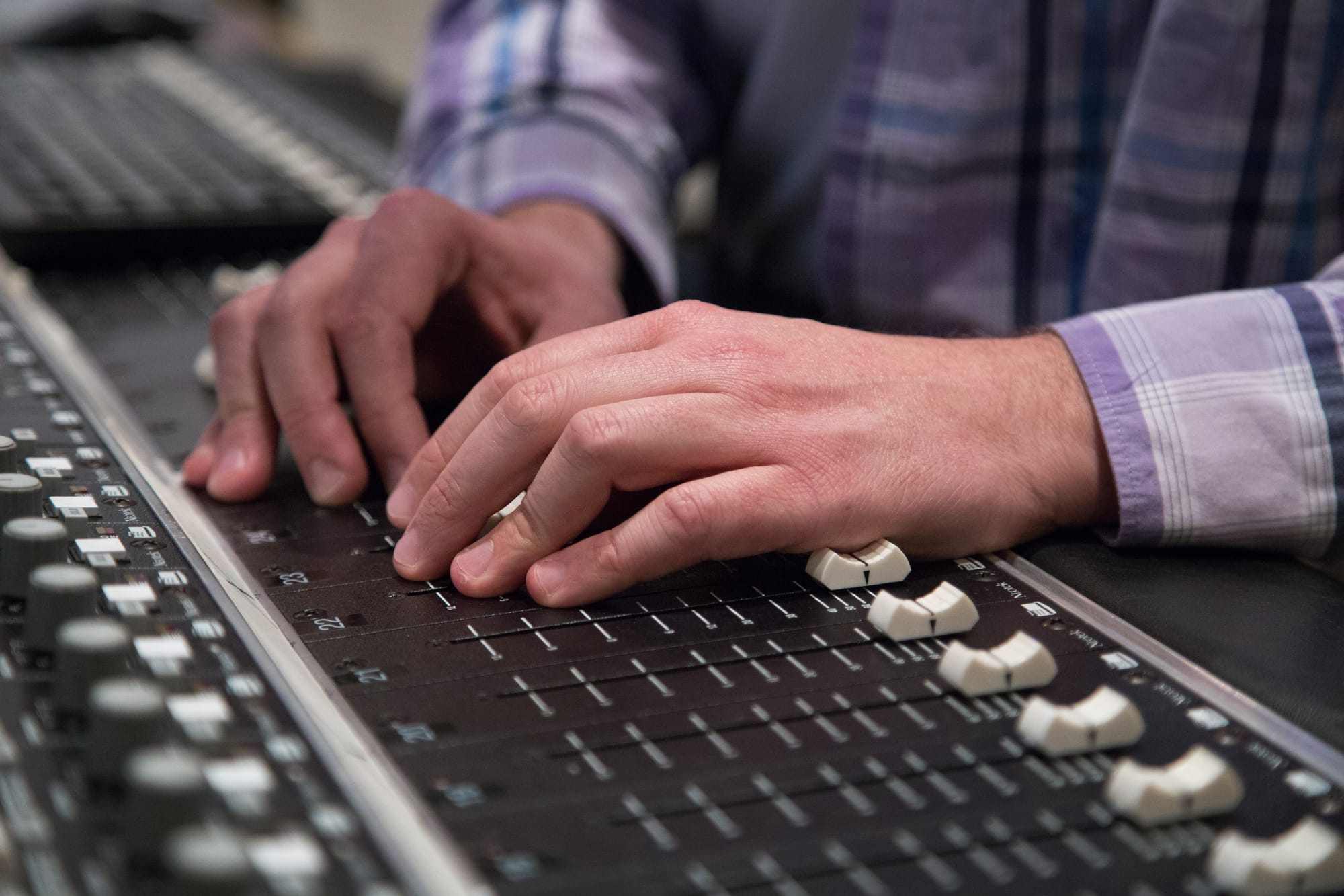 Rapper Scott "S-Class" Samels prepares his track "Corporatocracy" for his debut solo album in the Art Extension studio B on Tuesday. (Gabriella Angotti-Jones/ The Guardsman)