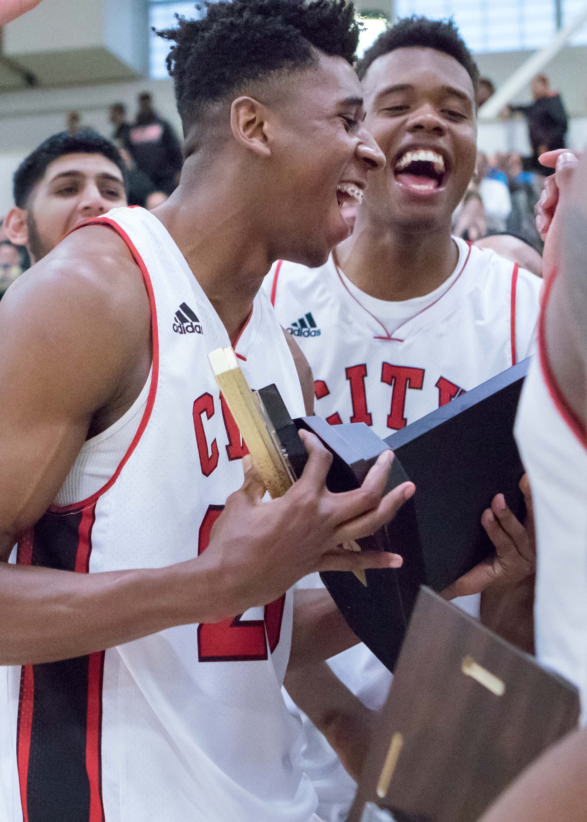 Tournament MVP Jalen Canty celebrates the championship win with his teammates following their win over Saddleback College in the CCCAA men's basketball tournament on March 13, 2016. (Photo by Peter Wong/Special to The Guardsman)