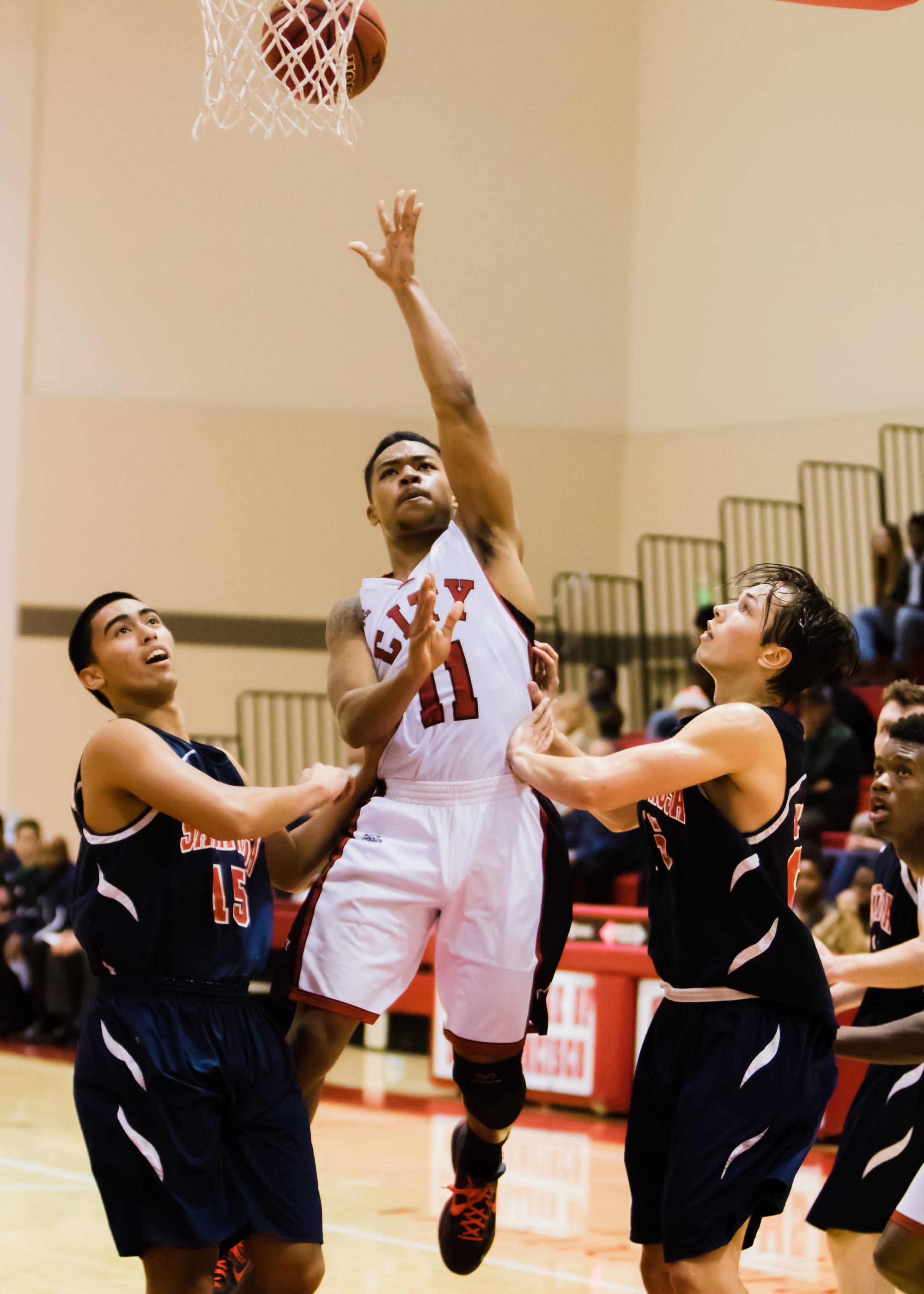 Trevor Dunbar (11) leaps through the Santa Rosa Junior College defenders in a playoff game on March 5, 2016. (Photo by Peter Wong/Special to The Guardsman)