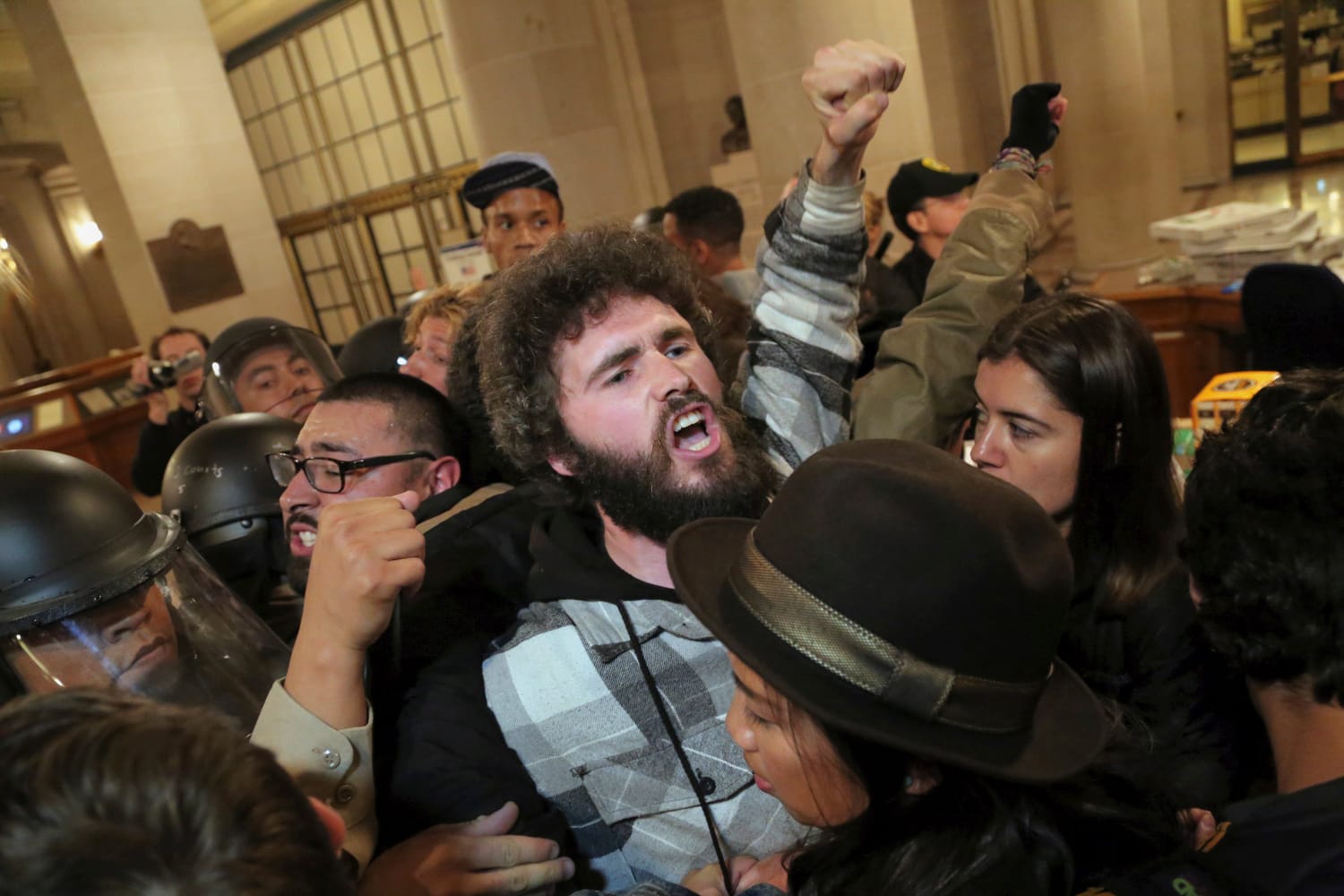 An activist is detained during a protest against alleged police brutality at City Hall during closed hours on Friday, May 6, 2016. (All photos by Gabriella Angotti-Jones/The Guardsman).