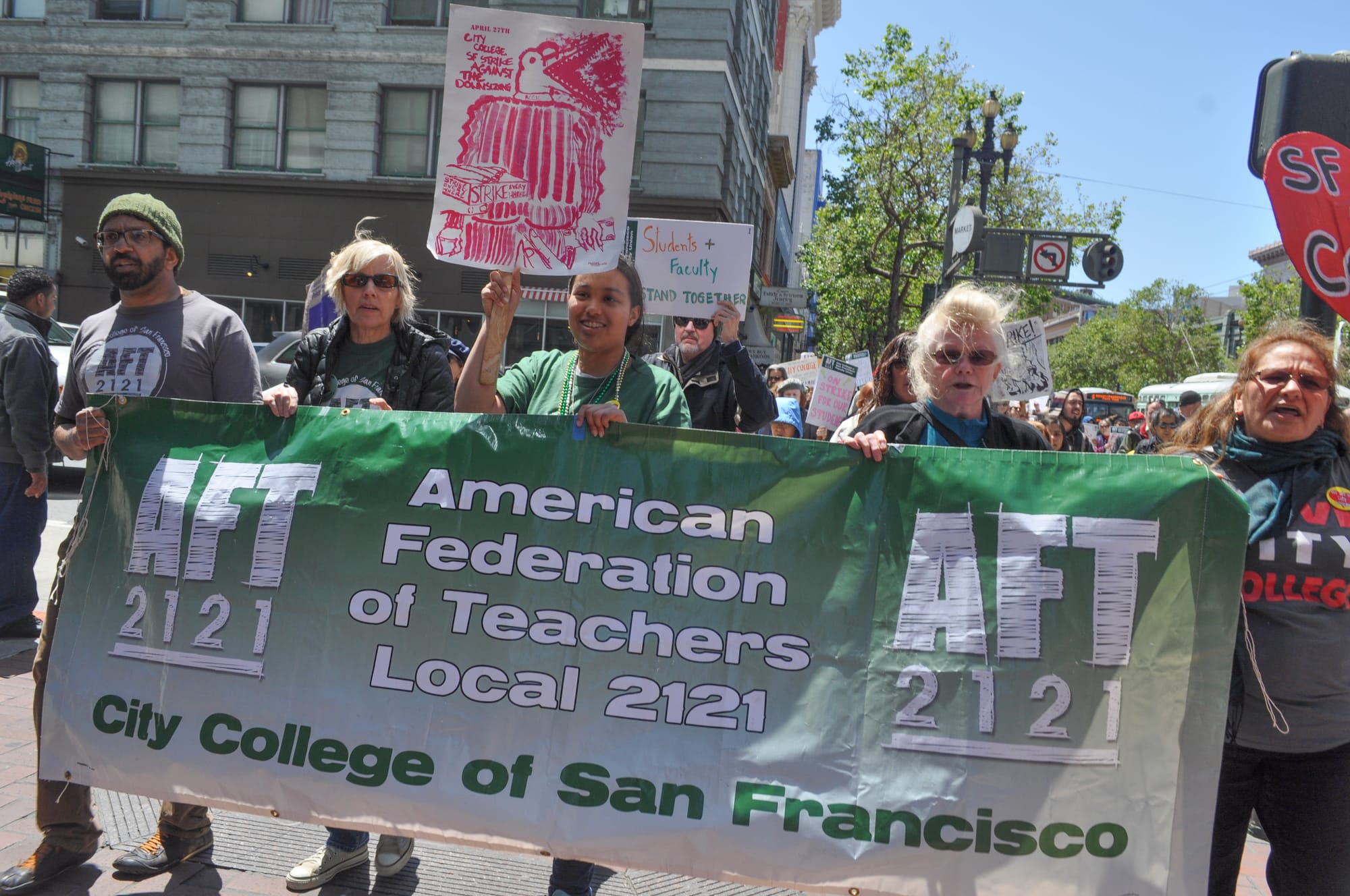 AFT members, teachers, students and protesters marching down Market Street towards the Civic Center campus of City College of San Francisco as part of the strike on April 27, 2016. (Photo by Bridgid Skiba/The Guardsman)