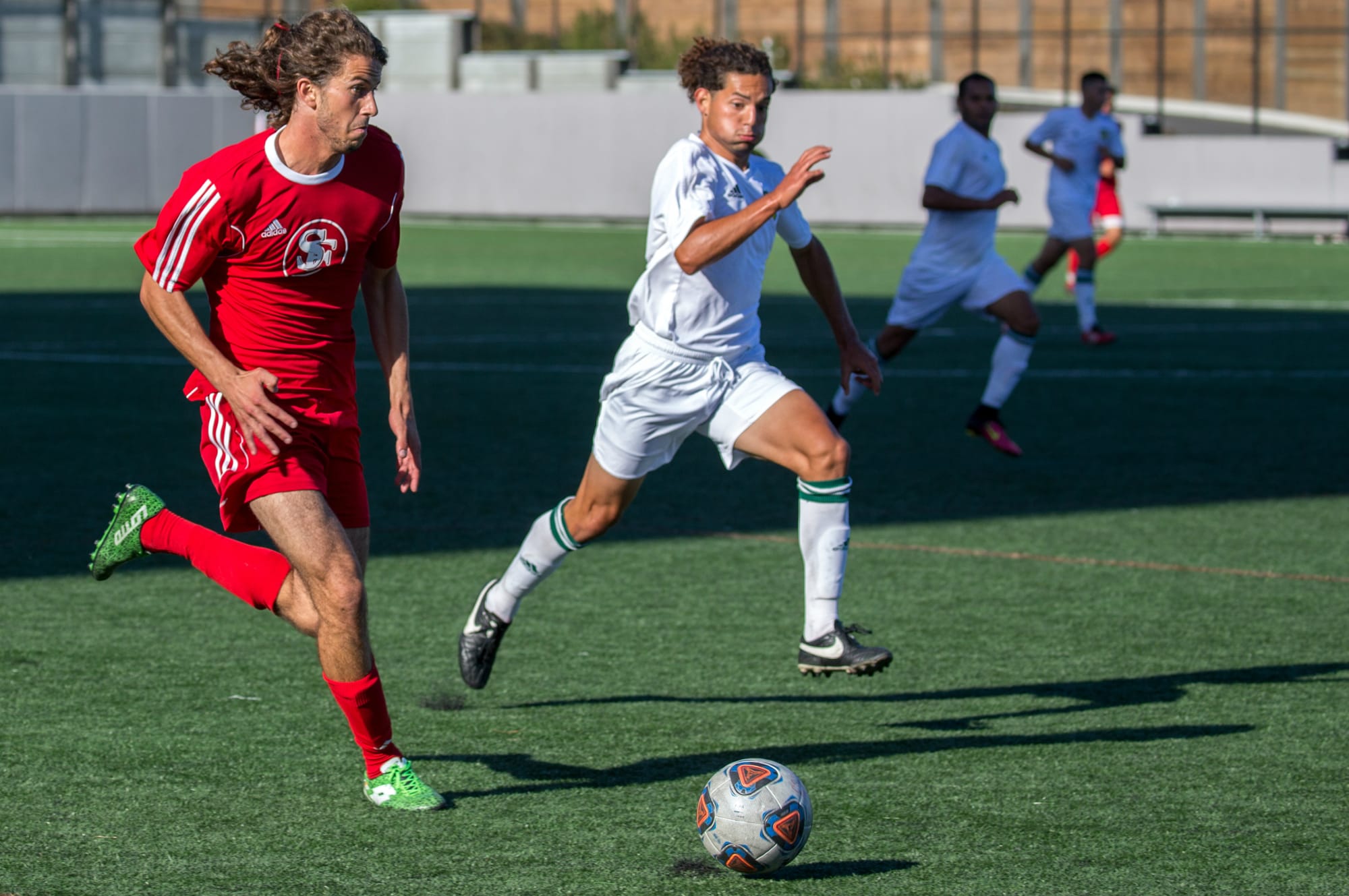 Gian Marco Zancanaro, left, pushes the ball downfield for the Rams in a match on Sept. 2. (Photo by Nathaniel Downes/Special to The Guardsman)