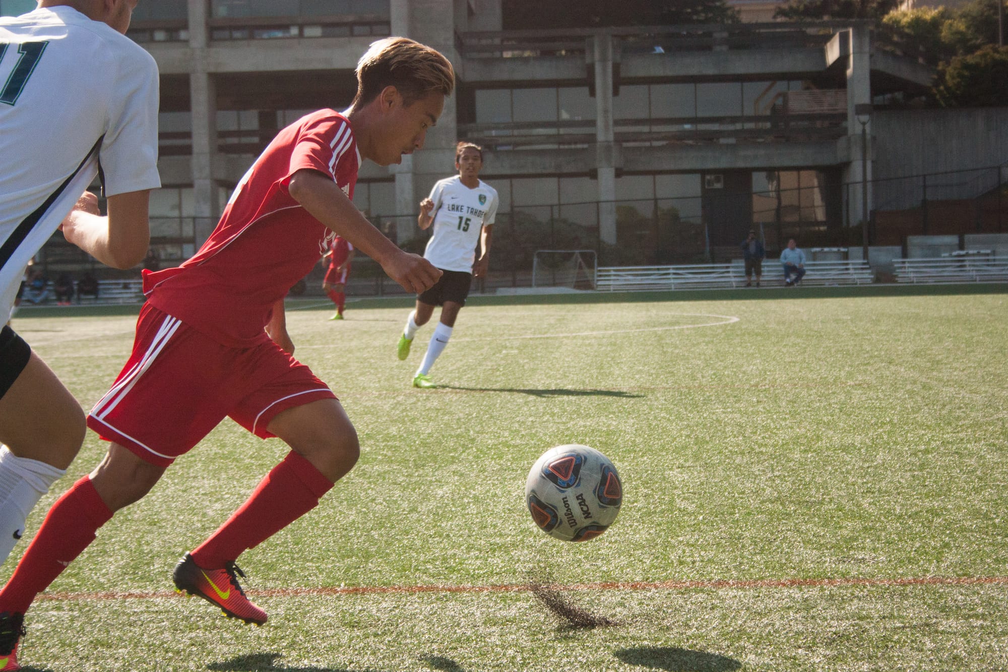 Karan Guran (#14) charges forward as Trujillo flanks his side attempting to stall the pass. Thursday, September 14, 2017. San Francisco, CA. Photo by Donald Ades. 