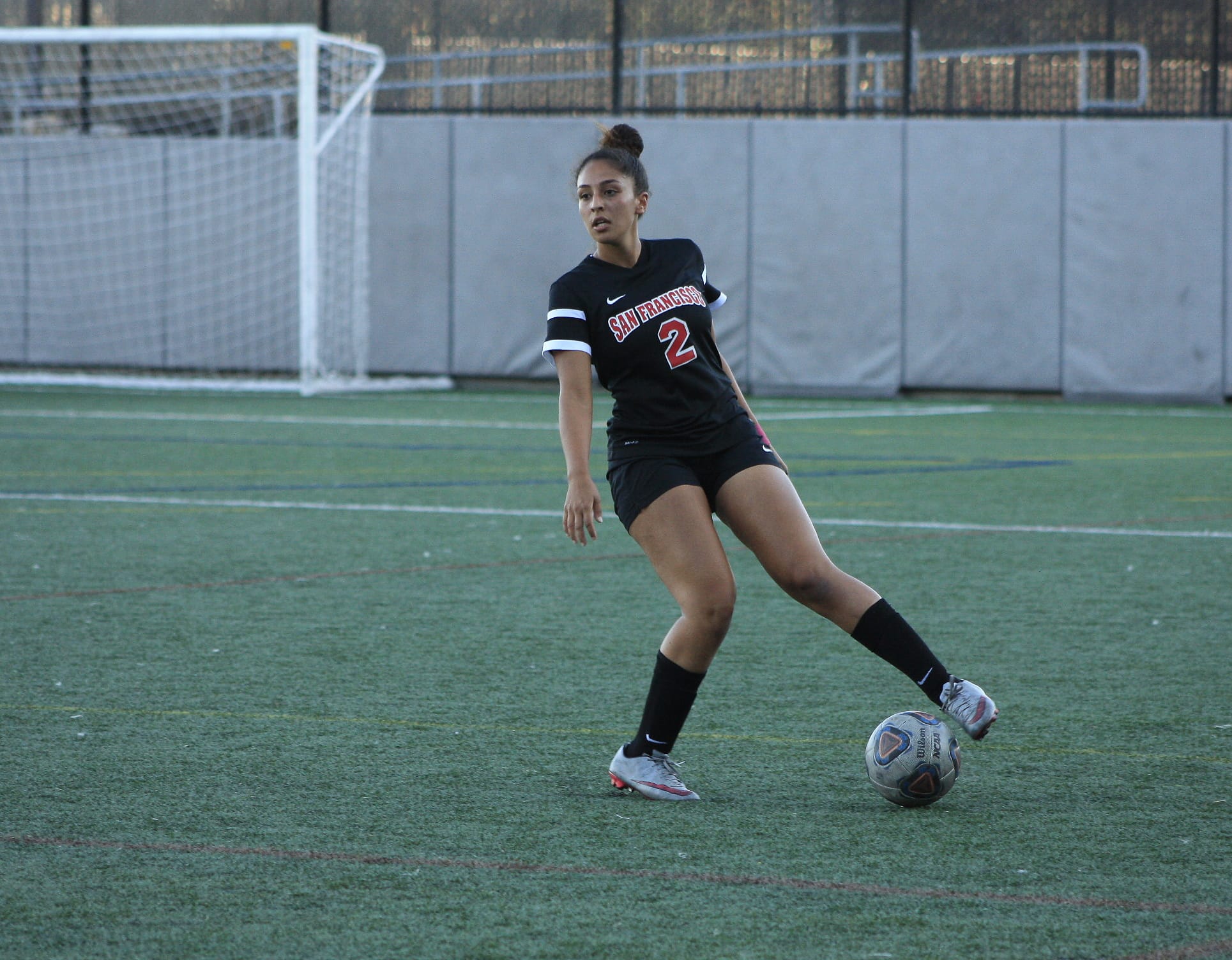 Danielle Nicotera (#2) looks around for a fellow player to pass to as she wraps her foot around the ball. October 6, San Francisco, (AP Photo/ Julia Fuller) 
