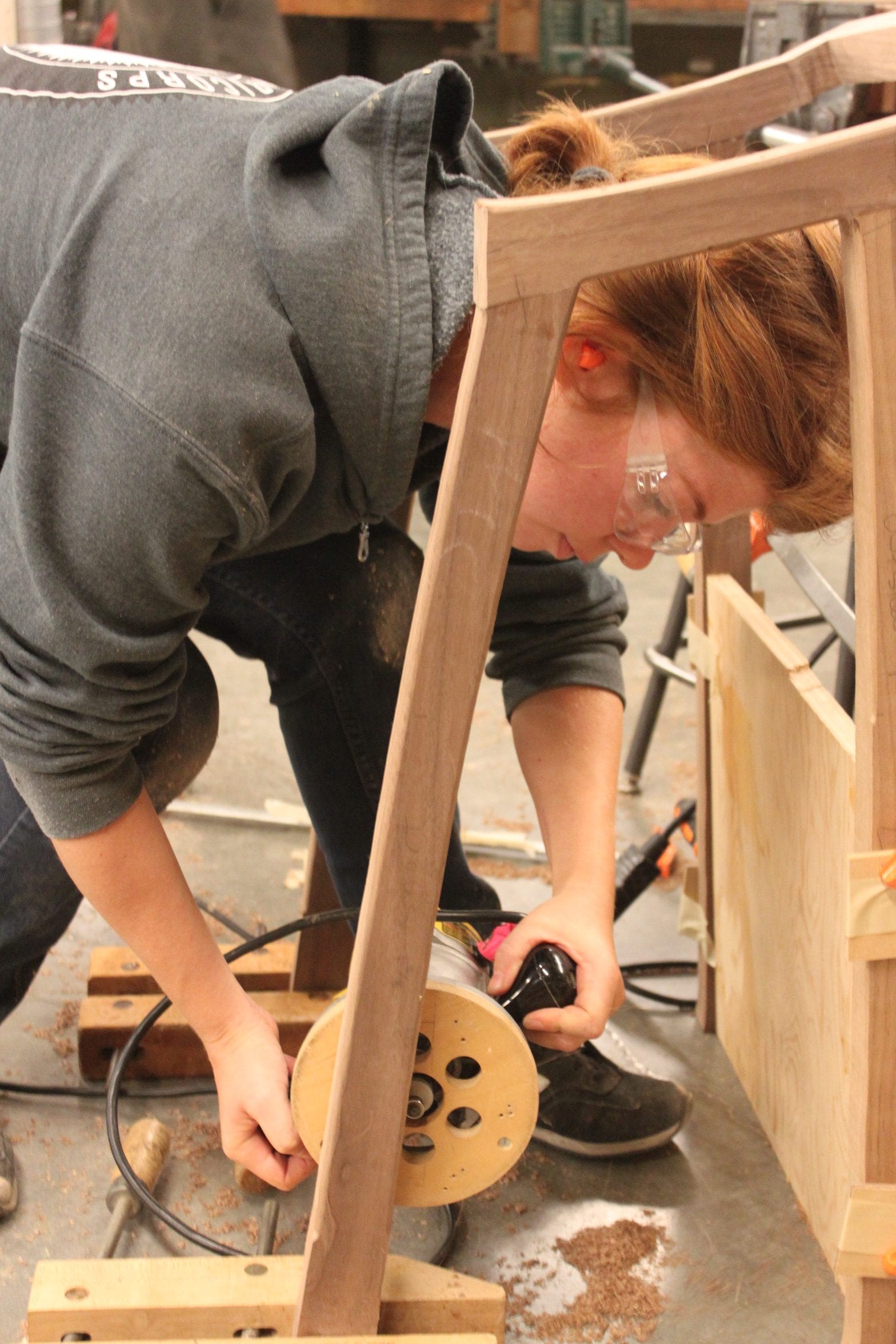 Individual projects can be found everywhere in the open floor plan of Room 257. Makenna Cook works on a chair this semester to go with a table she produced in Spring of 2017 in the same class. Photo taken on Nov. 6, 2017.   