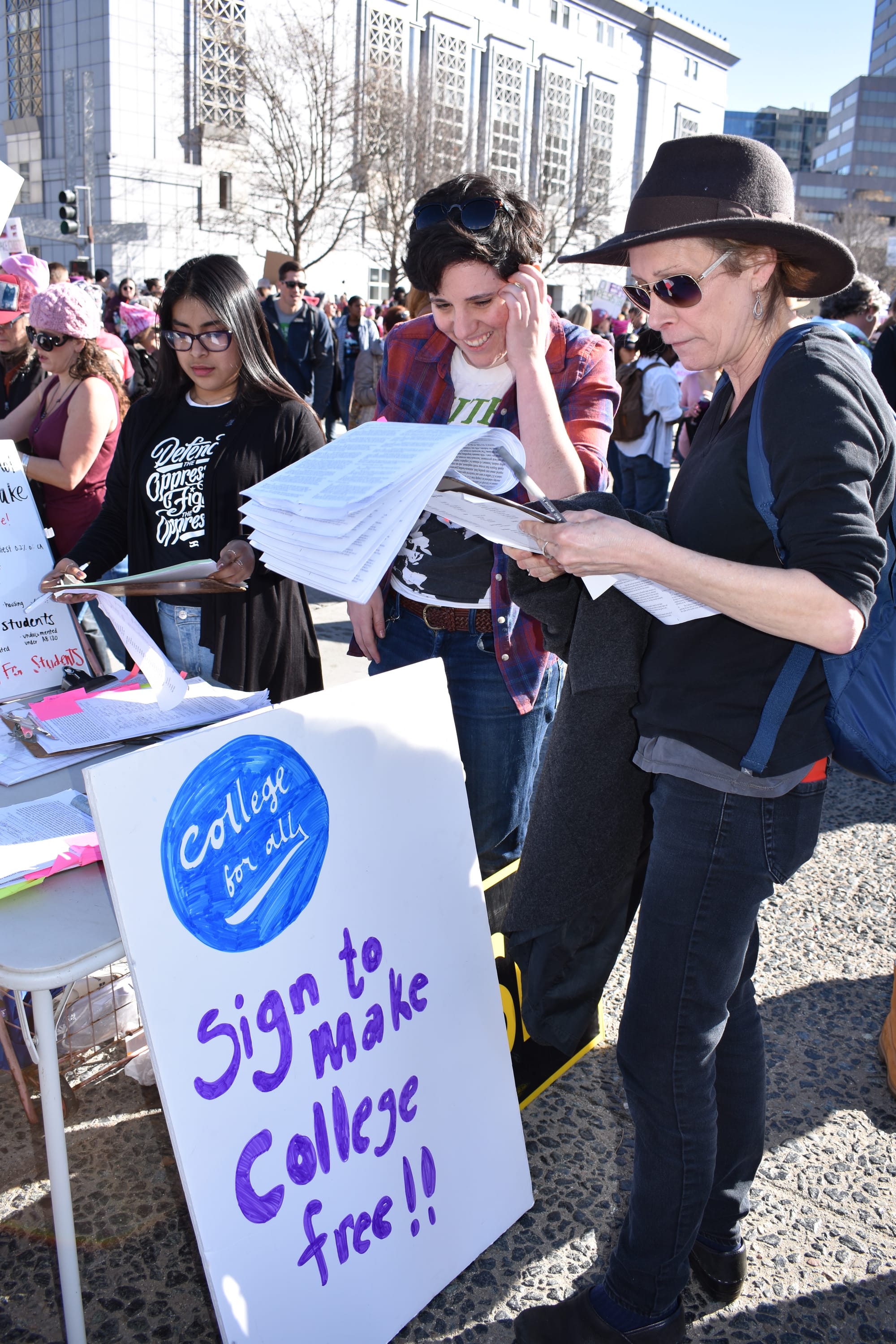 Demonstrators gathering in Civic Center Plaza prepare to protest in the Women's March in San Francisco on Jan. 20, 2018. Photo by Veronica Steiner/The Guardsman.