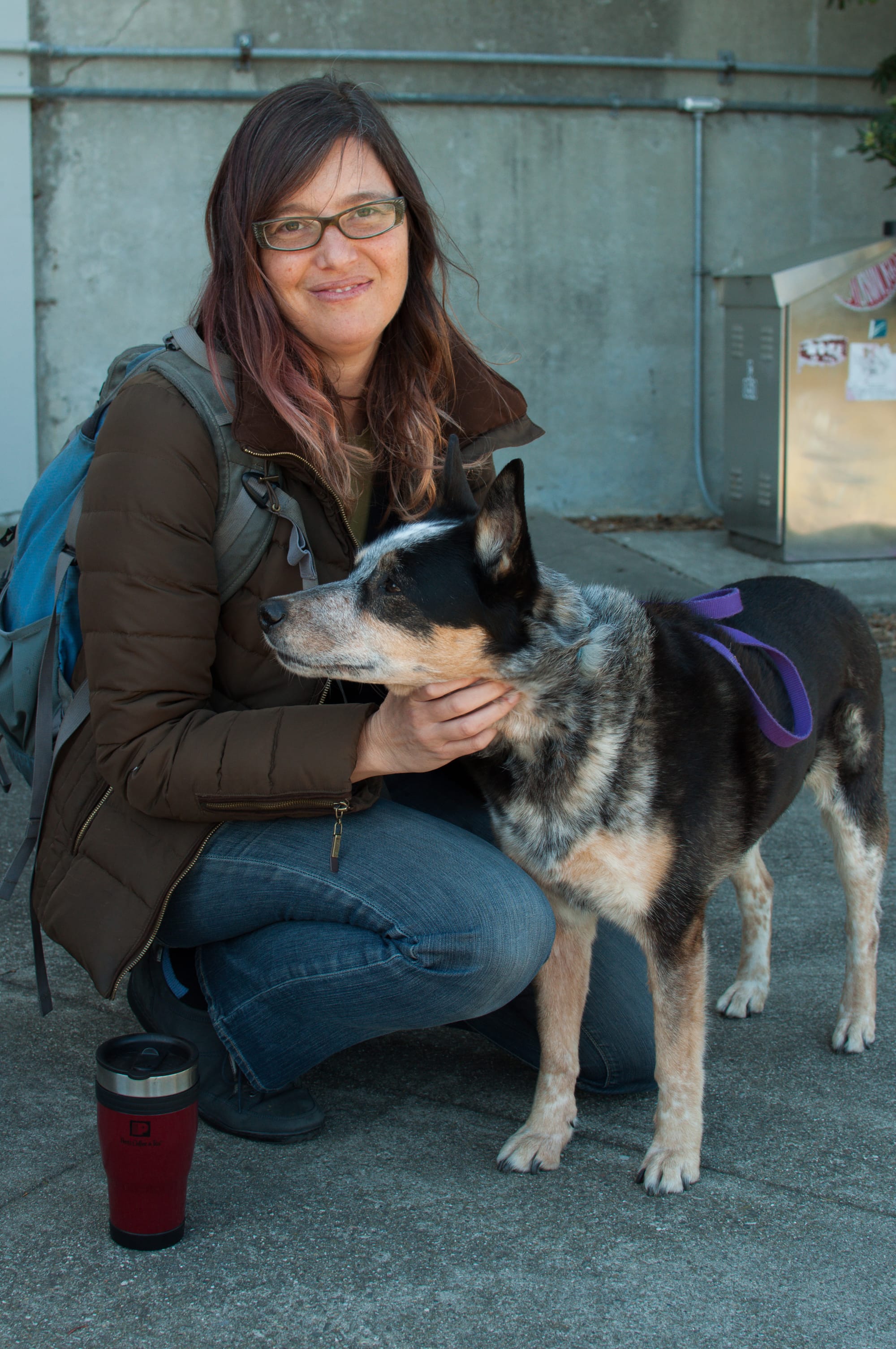 Anne Cassia, an English teacher at City College Ocean campus, walks her dog Lanie outside Cloud Hall before heading to class on Feb. 15, 2018. Photo by Janeth R. Sanchez/The Guardsman.