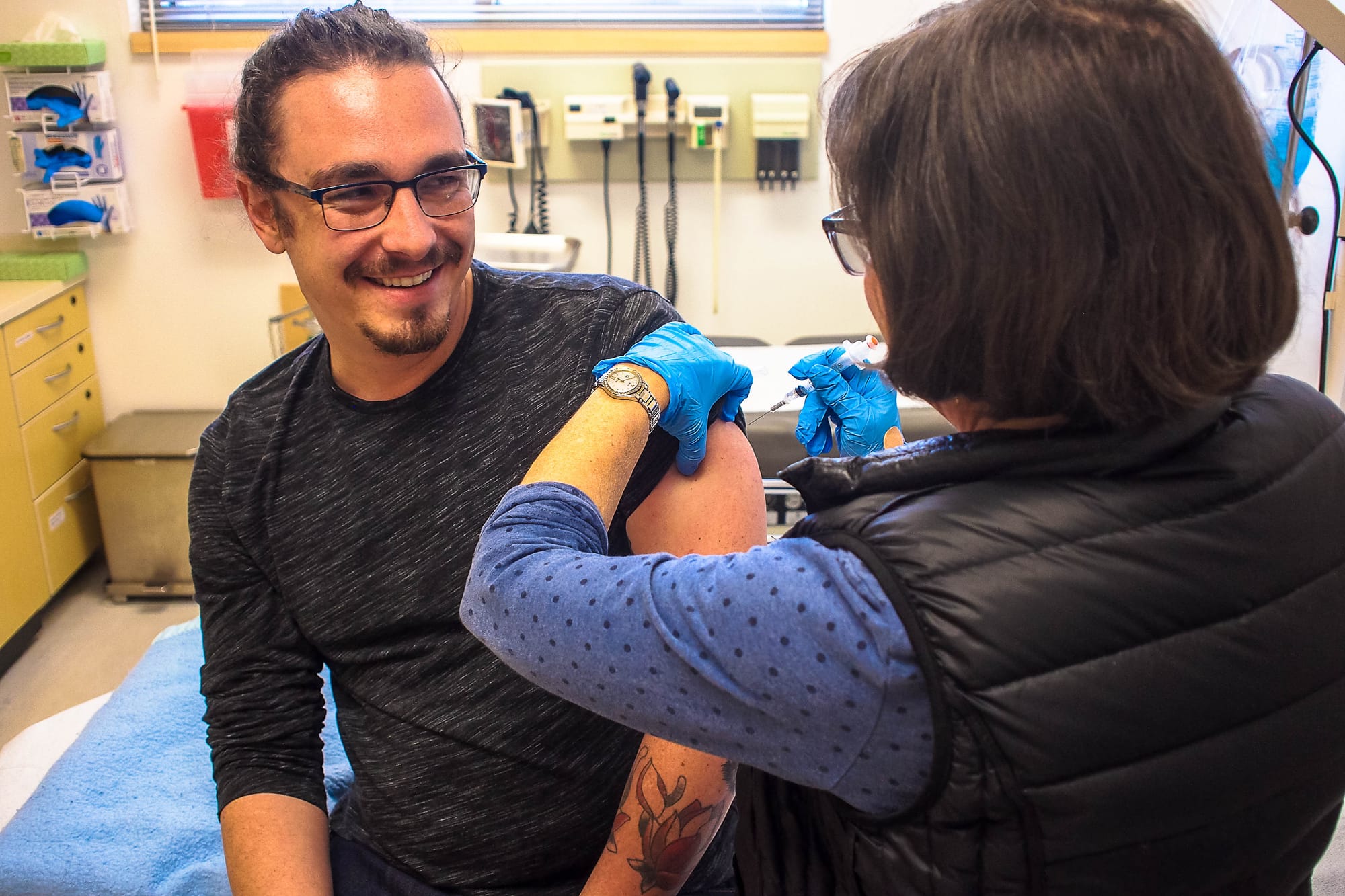 Jan. 24, 2018. Guardsman Reporter Cameron Ehring receiving the influenza vaccine from Nurse Practitioner Paula Cahill at Student Health Services on City College of San Francisco’s Ocean Campus. Photo courtesy of George Martiniano.