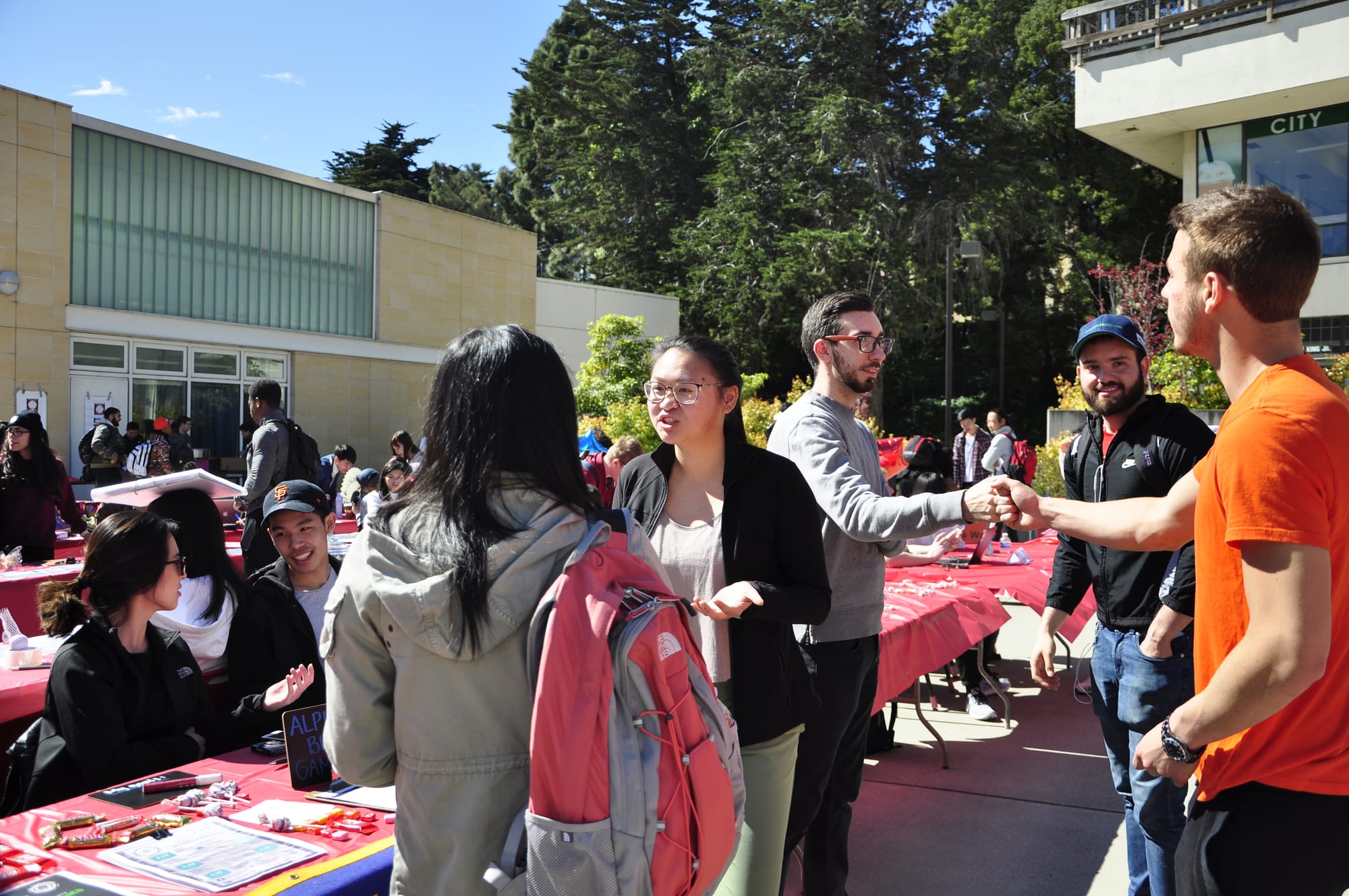 Diluoza Rakhmatullaeva, Morgan Ptellet, and Hee Jin Kang from the F1 Club talk to students during Unity Day at Ocean Campus on March 7, 2018. Photo by Janeth R. Sanchez/The Guardsman.