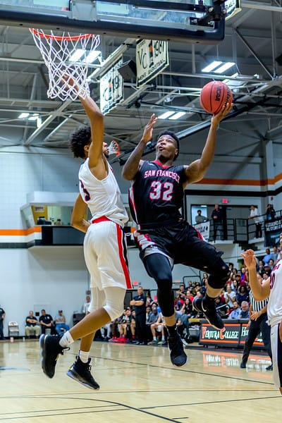 Freshman guard Dexter Hood (#32) elevates for the contested layup on March 13, 2018 during the CCCAA State Title game in Ventura. Photo by Peter Wong/Special to The Guardsman.