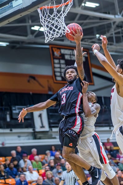 The Rams freshmen guard Niamey Harris (#3) goes up strong for the layup against two San Diego City College players in CCCAA State Title in Venutra on March 13, 2018. Photo by Peter Wong/Special to The Guardsman.