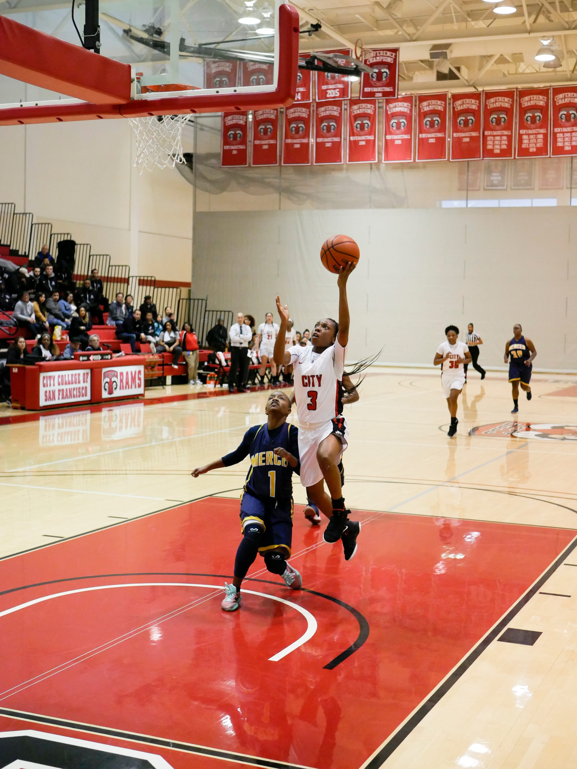 The Rams freshman guard Anissah Dorsey (#3) drives to the basket for a contested lay-up on March 3, 2018. Photo by James Comfort/Special to The Guardsman. 