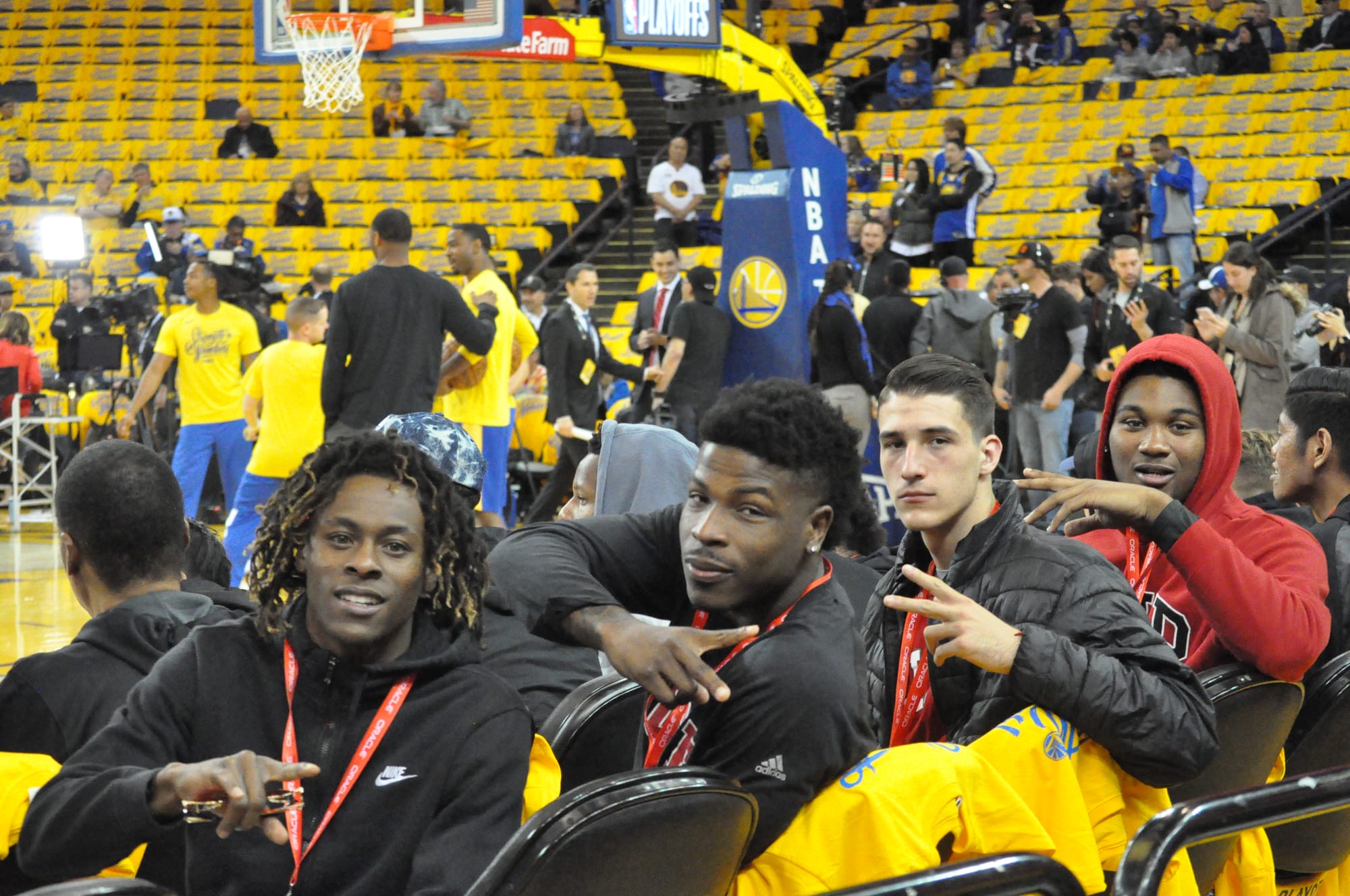 Rams men's basketball players Terrell Brown, left to right, Dexter Hood, Eddy Ionesco, and Lewis Hayes sit court side during Warriors warm-up session on April 16, 2018. Photo by Peter J. Suter/The Guardsman.