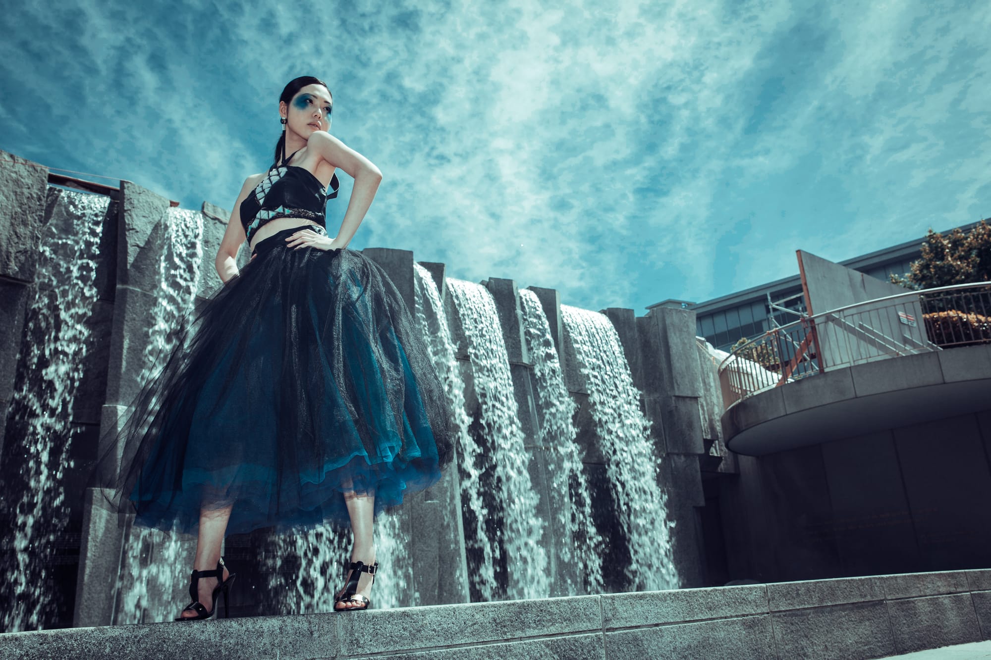 Model Stephanie Tan strikes a pose in a luminescent dress after the fashion show at Yerba Buena Gardens in San Francisco. Photo by Alexander Wong/Courtesy of Alexander Wong.  