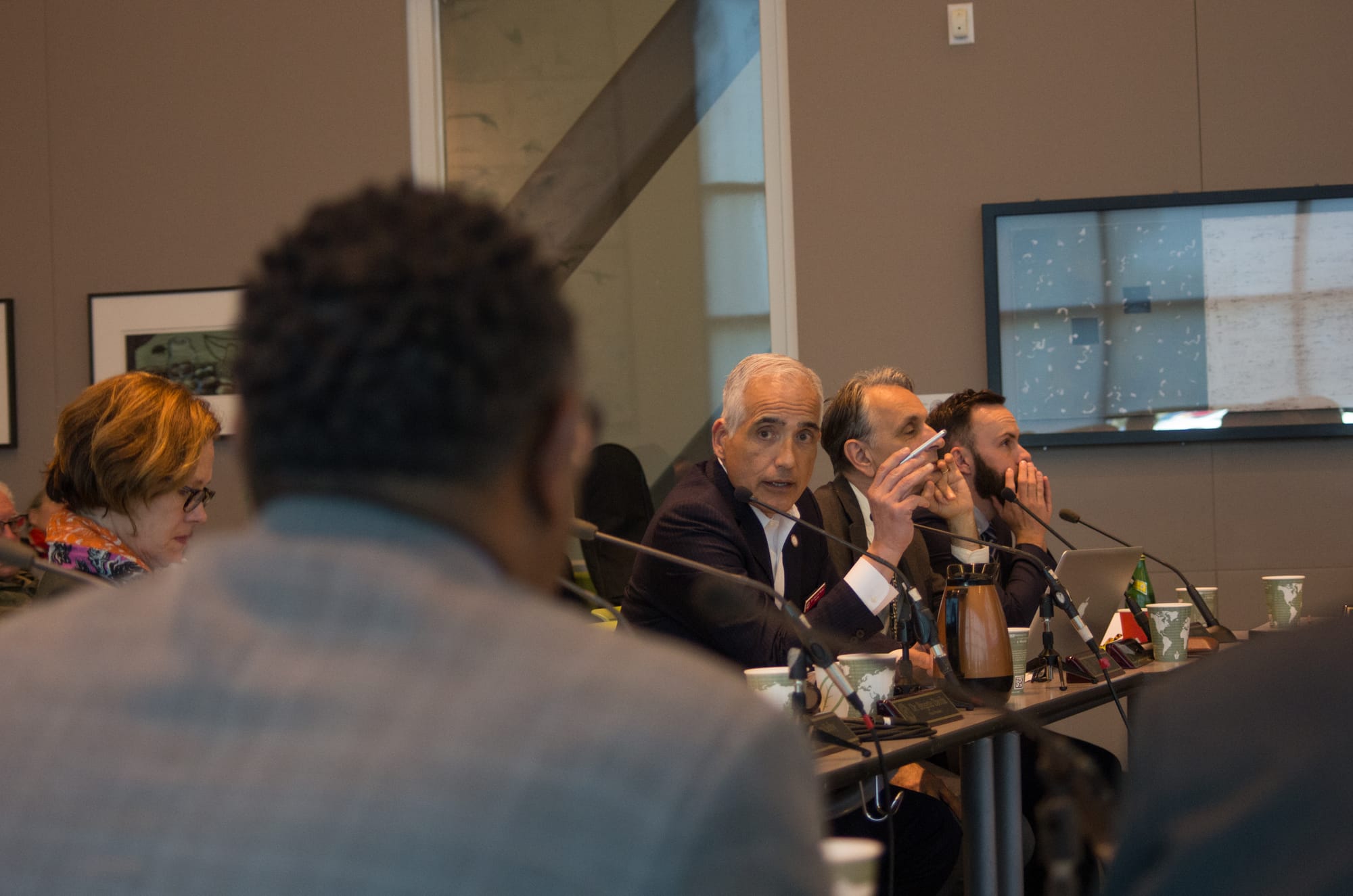 City College Chancellor Mark Rocha on May 3 discusses a presentation about the college's Facilities Master Plan with interim Facilities Vice Chancellor Rueben Smith at a Board of Trustees study session inside Ocean Campus's Multi-Use Building. (Courtesy of the Ingleside-Excelsior Light.)