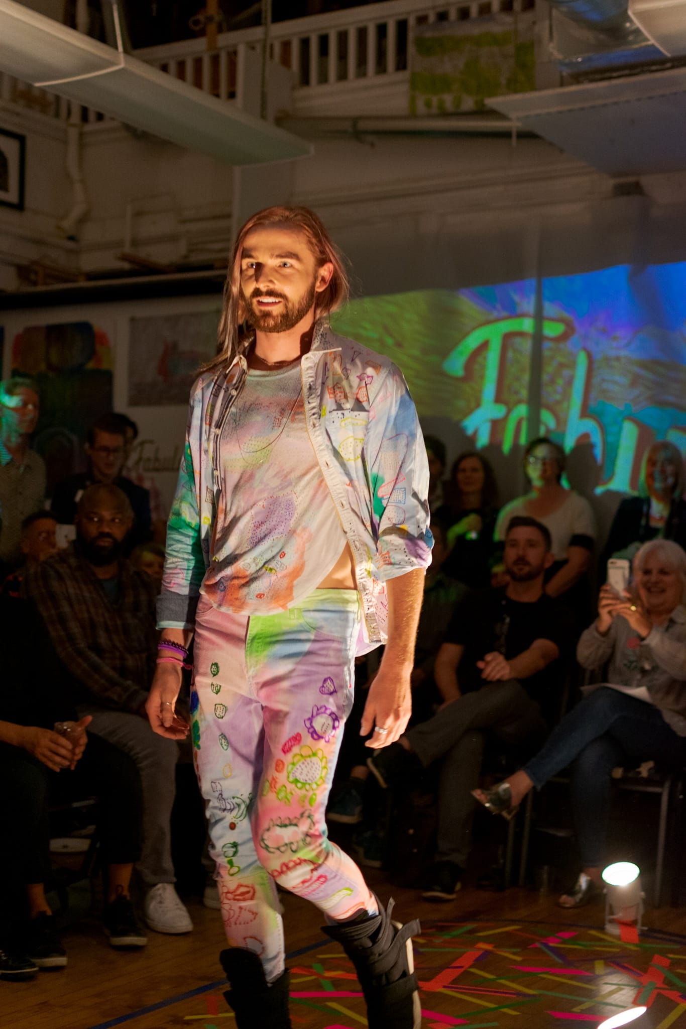 A model strides the catwalk in Makeya Kaiser's full set of hand drawn shirt, jeans and tee during the opening of the Fabulate fashion show. Thursday Sept. 20, 2018. Photo by Cliff Fernandes/The Guardsman 